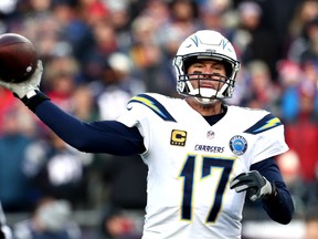 Los Angeles Chargers QB Philip Rivers throws during the third quarter in the AFC Divisional Playoff game against New England at Gillette Stadium  on Sunday. (Getty Images)