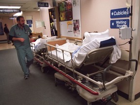 Patients wait in the hallway at the overcrowded Queensway-Carleton Hospital in Ottawa in 2016. (Errol McGihon/Postmedia)