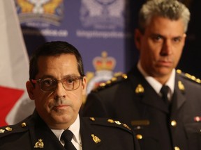 RCMP Supt. Peter Lambertucci, left, and Chief Supt. Michael LeSage, brief the media about a pair of police raids Thursday afternoon that resulted in the arrest of two people, one of which was charged with terrorism-related offences in Kingston, Ont. on Friday, Sept. 25, 2019. (Elliot Ferguson/The Whig-Standard/Postmedia Network)