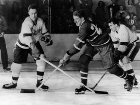 Former Red Wings and Leafs great Red Kelly, left, will have his number retired in Detroit on Friday. GETTY IMAGES FILE