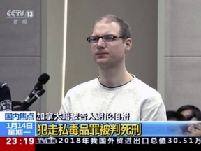 In this image taken from video footage run by China's CCTV, Canadian Robert Lloyd Schellenberg attends his retrial at the Dalian Intermediate People's Court in Dalian, in Liaoning province, on Monday, Jan. 14, 2019.
