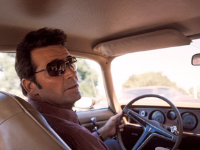 Jim Rockford (James Garner) behind the wheel of his iconic Pontiac Firebird in The Rockford Files.