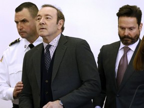 Actor Kevin Spacey enters the courtroom at district court for arraignment on a charge of indecent assault and battery on Monday, Jan. 7, 2019, in Nantucket, Mass. The Oscar-winning actor is accused of groping the teenage son of a former Boston TV anchor in 2016 in the crowded bar at the Club Car in Nantucket. (Nicole Harnishfeger/The Inquirer and Mirror via AP, Pool)