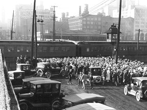 From the time trains began crossing the city's waterfront more than a century-and-a-half ago, pedestrians (as well as horses and wagons) were at risk. In this 1923 photo from the City of Toronto Archives a large crowd of pedestrians, no doubt returning from a Maple Leaf baseball game at the Hanlan's Point Stadium on Toronto Island, wait patiently while a passenger train clears the Bay St. crossing. However, there were many instances when people held up by the slowly shunting or stopped trains — eager to catch the ferry to a school, church picnic on the Island, or a lake steamer bound for Queenston with a connection to the Falls — decided to chance it by crawling under one of the railway cars. A sudden start up could mean disaster.