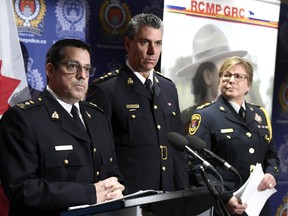 Supt. Peter Lambertucci, left, Officer in Charge INSET Ottawa answers questions from reporters as Chief Supt. Michael LeSage, Criminal Operations Officer, RCMP "O" Division and Kingston Police chief Antje McNeely look on during a press conference, after RCMP charged a youth with terrorism, in Kingston, Ont. on Friday, Jan. 25, 2019. (THE CANADIAN PRESS/Justin Tang)