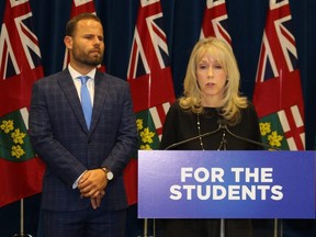 Minister Merrilee Fullerton speaks to the media as Training, Colleges and Universities Parliamentary Assistant David Piccini listens on Thursday, Jan. 17, 2019. Antonella Artuso/Toronto Sun