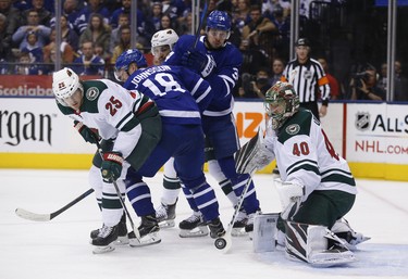 Minnesota Wild Devan Dubnyk G (40) and teammate  Jonas Brodin D (25)  watch the puck go wide during first period in Toronto on Thursday January 3, 2019. Jack Boland/Toronto Sun/Postmedia Network