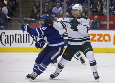 Minnesota Wild Charlie Coyle C (3) and Toronto Maple Leafs Andreas Johnsson LW (18) joust in front of the net during first period in Toronto on Thursday January 3, 2019. Jack Boland/Toronto Sun/Postmedia Network