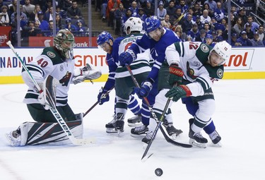 Minnesota Wild Eric Staal C (12) and Toronto Maple Leafs John Tavares C (91) fight for control of the puck during third period in Toronto on Thursday January 3, 2019. Jack Boland/Toronto Sun/Postmedia Network