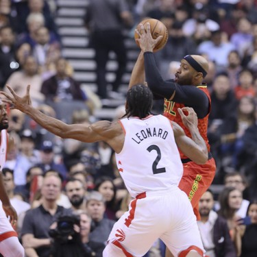 Toronto Raptors forward Kawhi Leonard (2) and Atlanta Hawks forward Vince Carter (15) in Toronto, Ont. on Tuesday January 8, 2019. The Toronto Raptors host the Atlanta Hawks. Veronica Henri/Toronto Sun/Postmedia Network