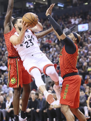 Toronto Raptors guard Fred VanVleet (23) and Atlanta Hawks forward Vince Carter (15) in Toronto, Ont. on Tuesday January 8, 2019. The Toronto Raptors host the Atlanta Hawks. Veronica Henri/Toronto Sun/Postmedia Network