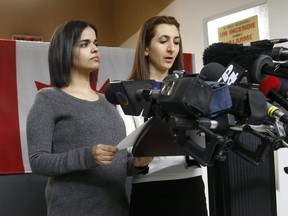 Rahaf Mohammed speaks to the media flanked by Dr. Saba Abbas (R) , her settlement worker/translator, at the COSTI Corvetti Education Centre in Toronto on January 15, 2019. Jack Boland/Toronto Sun