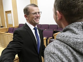 Robert Crosland smiles at son Mario Crosland after Robert was found not guilty of misdemeanor animal cruelty, Friday, Jan. 4, 2019, in Preston, Idaho. (Eli Lucero/Herald Journal via AP)