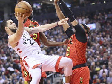 Raptors guard Fred VanVleet (23) shoots over Vince Carter of the Atlanta Hawks on Tuesday night at Scotiabank Arena.