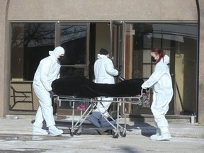 The body of one man gunned down in a deadly murder is carted away from the Dream Palace Banquet Hall in Vaughan on Saturday January 26, 2019. (Veronica Henri/Toronto Sun/Postmedia Network)