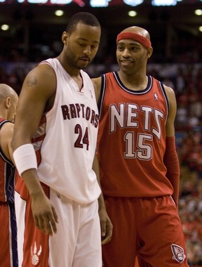Former teammate Vince Carter casts a smirk at downcast Morris Peterson after the Raptors lost Game 1 of their first-round NBA playoff series against the New Jersey Nets 96-91 at the ACC.