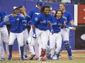 Blue Jays’ prospect Vladimir Guerrero Jr. celebrates his walk-off homerun last March during a pre-season game in Montreal. (CP FILES)