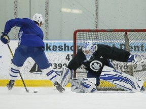 Leafs’ William Nylander goes backhand on goalie Garret Sparks at practice on Wednesday. JACK BOLAND/TORONTO SUN