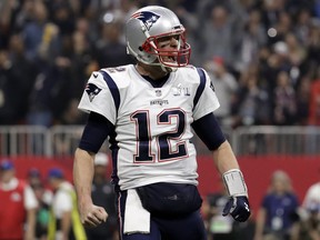 New England Patriots' Tom Brady celebrates a touchdown during Sunday's Super Bowl win over the L.A. Rams. (AP PHOTO)