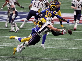 Rob Gronkowski #87 of the New England Patriots misses a pass on fourth and one  under pressure from John Johnson #43 of the Los Angeles Rams in the second quarter during Super Bowl LIII at Mercedes-Benz Stadium on February 03, 2019 in Atlanta, Georgia. (Photo by Patrick Smith/Getty Images)