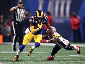 Todd Gurley of the Los Angeles Rams runs the ball against Jonathan Jones #31 of the New England Patriots in the second half during Super Bowl LIII at Mercedes-Benz Stadium on February 03, 2019 in Atlanta, Georgia.