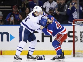 Neal Pionk of the New York Rangers scraps with  Zach Hyman of the Toronto Maple Leafs at Madison Square Garden on February 10, 2019 in New York City. (Photo by Bruce Bennett/Getty Images)
