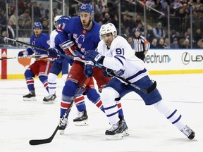 Kevin Hayes #13 of the New York Rangers slows down John Tavares #91 of the Toronto Maple Leafs during the first period at Madison Square Garden on February 10, 2019 in New York City.