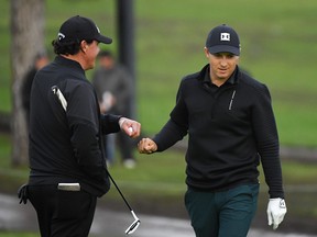 Phil Mickelson (L) and Jordan Spieth react to a shot on the second hole during the first round of the Genesis Open at Riviera Country Club on February 14, 2019 in Pacific Palisades, California. (Photo by Harry How/Getty Images)
