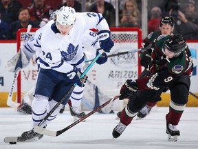 Kasperi Kapanen of the Toronto Maple Leafs skates with the puck past Clayton Keller #9 of the Arizona Coyotes during the third period of the NHL game at Gila River Arena on February 16, 2019 in Glendale, Arizona.