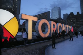 The “TORONTO” sign at Nathan Phillips Square was lit up in gold on Feb. 11, 2019. (Veronica Henri, Toronto Sun)
