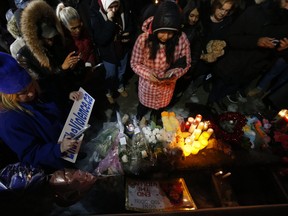 People gathered at Garden Square in Brampton on Tuesday night for a vigil for Riya Rajkumar. (Jack Boland, Toronto Sun)