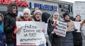 Parents protest outside MPP Lisa MacLeod’s constituency office in Barrhaven claiming that the recent funding announcement for autistic children is not nearly enough. (Wayne Cuddington/ Postmedia)