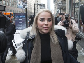 Marcella Zoia, 19 , leaves College Park courts on  Feb. 13, 2019. (Stan Behal, Toronto Sun)