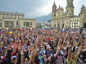 Venezuelan opposition supporters living in Colombia take part in a demonstration to back Venezuelan opposition leader Juan Guaido's calls for early elections, at Plaza de Bolivar square in Bogota, on February 2, 2019. (Diana Sanchez/AFP/Getty Images)