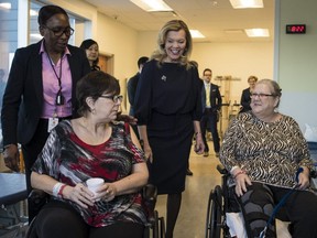 Health Minister Christine Elliott greets patients at Bridgepoint Active Healthcare before making an announcement in Toronto on Feb. 26, 2019. (THE CANADIAN PRESS)