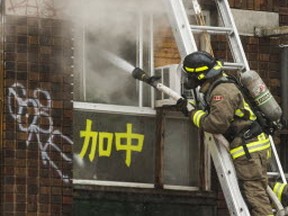 Firefighters battle a three-alrm fire on Spadina Ave., just north of Dundas St. W., in Toronto, Ont. on Wednesday February 6, 2019. Ernest Doroszuk/Toronto Su