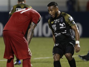 Toronto FC forward Terrence Boyd is taunted by Gerardo Negrete of Club Atletico Independiente FC after missing a penalty kick on Tuesday. (AP PHOTO)