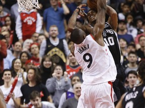 Toronto Raptors' Serge Ibaka blocks San Antonio Spurs' DeMar DeRozan during Friday's game. (JACK BOLAND/Toronto Sun)