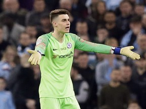 Chelsea goalkeeper Kepa Arrizabalaga (right) gestures to the sideline during Sunday's game against Man City. (AP PHOTO)