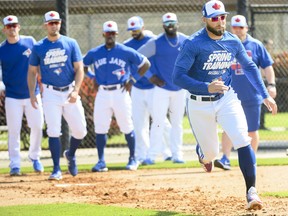 Toronto Blue Jays outfielder Kevin Pillar, right, runs the bases at practice during baseball spring training in Dunedin, Fla. THE CANADIAN PRESS/Nathan Denette