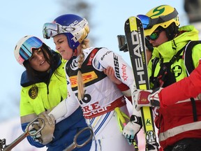 Lindsey Vonn (second from left) of the U.S. gets help after she crashed during the women's Super G event of the 2019 FIS Alpine Ski World Championships at the National Arena in Are, Sweden, on Feb. 5, 2019. (JONATHAN NACKSTRAND/AFP/Getty Images)