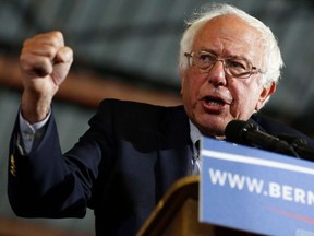 This file photo taken on June 6, 2016 shows then-Democratic presidential candidate Senator Bernie Sanders speaking during a rally at Barker Hangar in Santa Monica, Calif. on June 7, 2016.