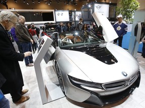 Visitors check out a vehicle at the Canadian International AutoShow in 2019.