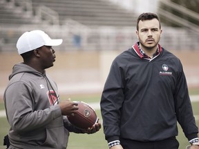 In this Jan. 22, 2019, photo released by the Alliance of American Football, Charlie Ebersol, CEO and co-founder of the Alliance of American Football, right, walks on the field next to Darwin Beacham, San Antonio Commanders equipment manager, in San Antonio. (Alliance of American Football via AP) ORG XMIT: FX503