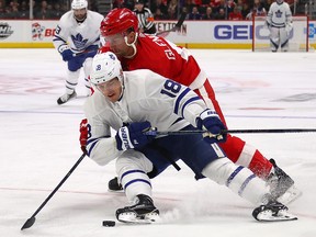 Andreas Johnsson of the Toronto Maple Leafs battles for the puck with Luke Glendening of the Detroit Red Wings at Little Caesars Arena on February 1, 2019 in Detroit. (Gregory Shamus/Getty Images)