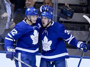 Maple Leafs centre Auston Matthews (34) celebrates his goal with teammate Patrick Marleau against the Senators during NHL action in Toronto on Wednesday, Feb. 6, 2019.