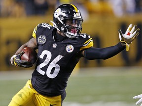In this Nov. 26, 2017, file photo, Pittsburgh Steelers running back Le'Veon Bell runs during a game in Pittsburgh. (AP Photo/Keith Srakocic, File)