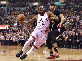 Toronto Raptors forward Kawhi Leonard (2) drives around LA Clippers forward Tobias Harris (34)during first half NBA basketball action in Toronto on Sunday Feb. 3, 2019. THE CANADIAN PRESS/Frank Gunn