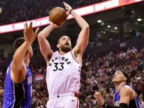 Marc Gasol (right) put up a shot against the Magic on Sunday. The Raptors play host to the Celtics tonight.  Frank Gunn/CP