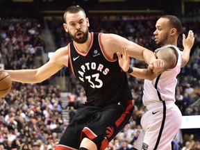 Toronto Raptors Marc Gasol controls the ball as Brooklyn Nets guard Shabazz Napier (13) defends during second half NBA basketball action in Toronto on Monday, Feb. 11, 2019. THE CANADIAN PRESS/Frank Gunn ORG XMIT: FNG215